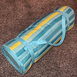 Beach mat with head rest.